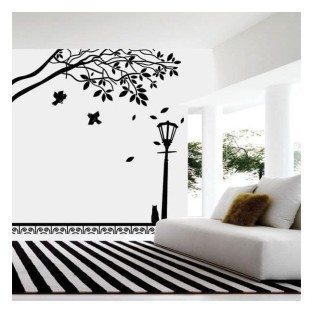 Vinilo decorativo gato en farola bajo árbol otoñal