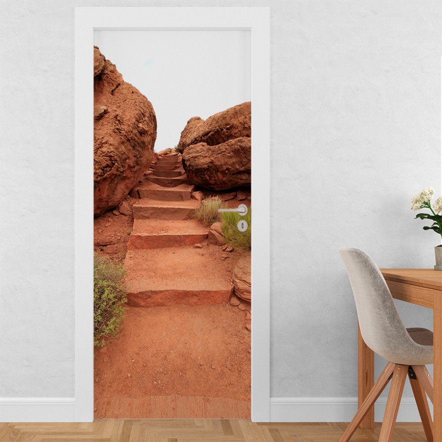 Vinilo para puerta entre rocas