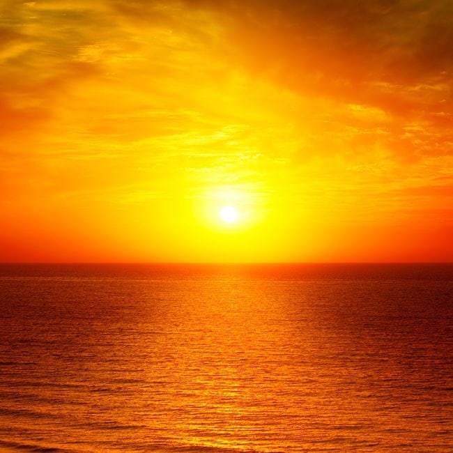 Fotomural sol atardecer frente al mar