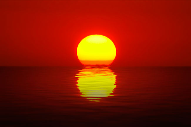 Fotomural sol poniéndose sobre el  mar
