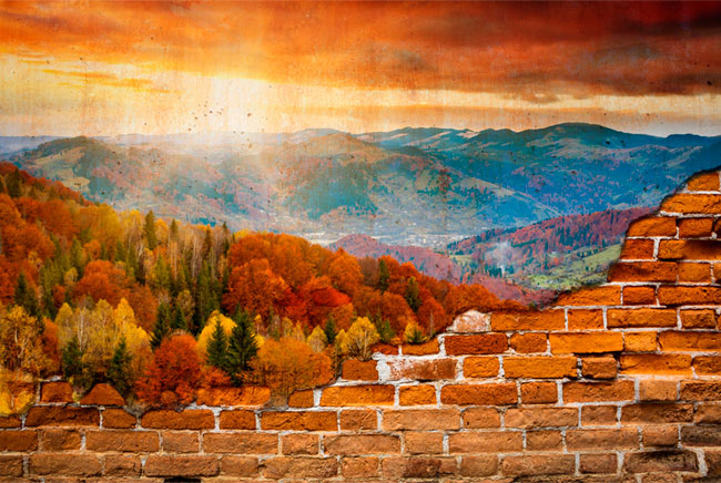 Fotomural efecto pared rota atardecer en las montañas